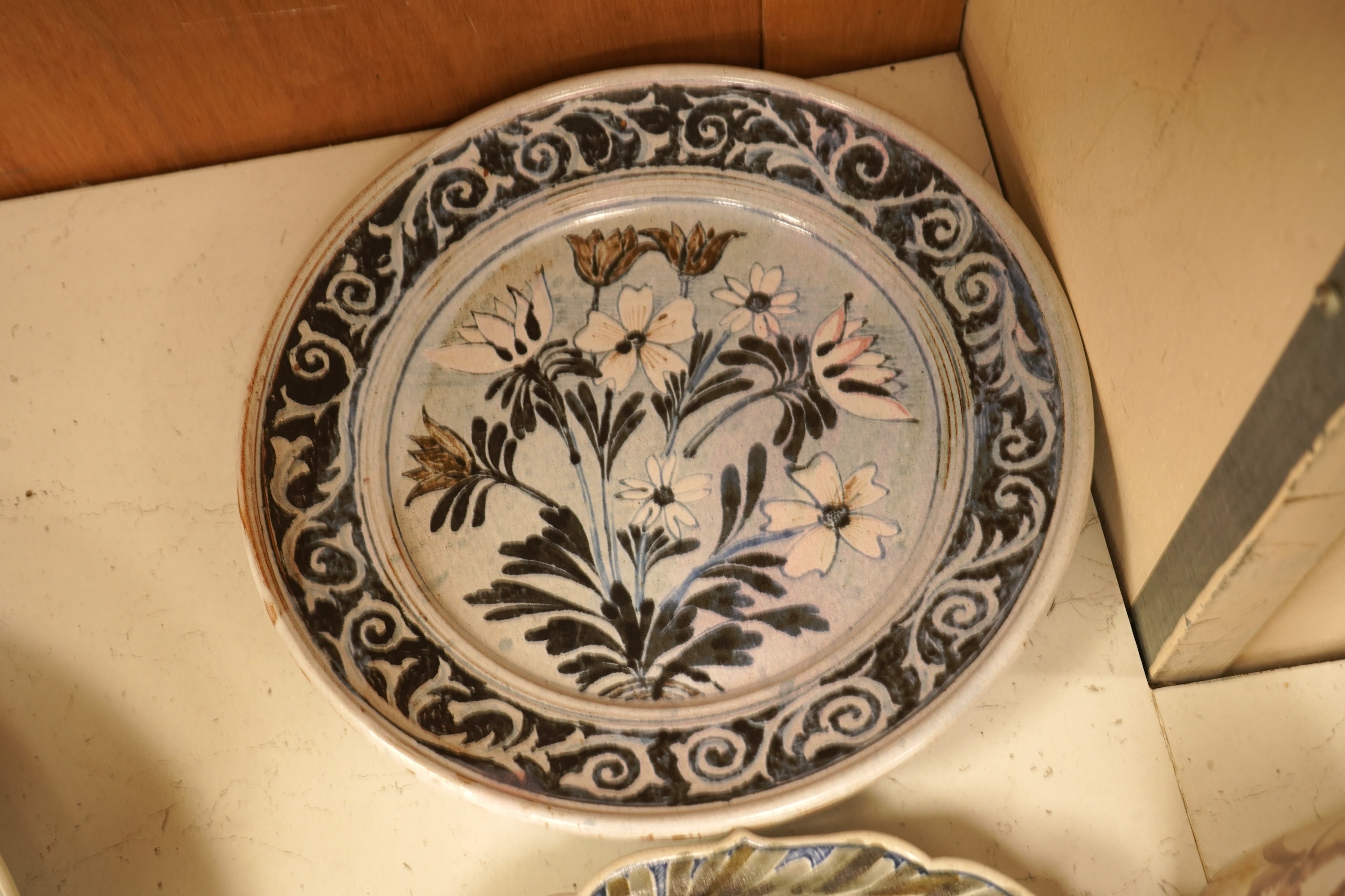 A mixed collection of European studio pottery to include a collection of four tall Italian candlesticks, tallest 58cm, two stoneware plates and a tureen and cover, etc.